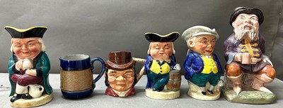 Lot 792 - A selection of Toby jugs of various sizes and...