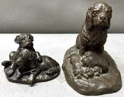 Lot 794 - A pair of sculptures of dogs and puppies
