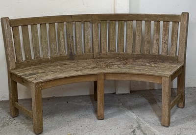 Lot 196 - A teak curved bench H90cm W160cm D 50cm