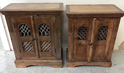 Lot 22 - Two hardwood side cabinet with pierced fronts...