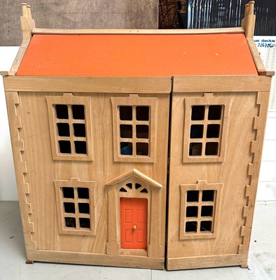 Lot 656 - A Victorian doll house with a natural wood...