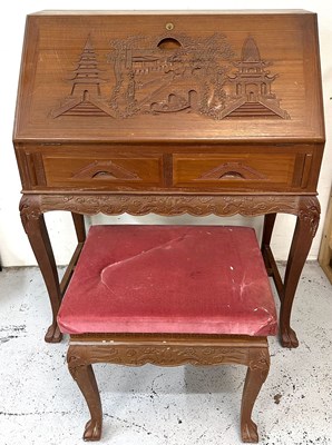 Lot 174 - A Chinese carved bureau desk with a detailed...