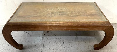 Lot 58 - An oriental wooden coffee table with intricate...