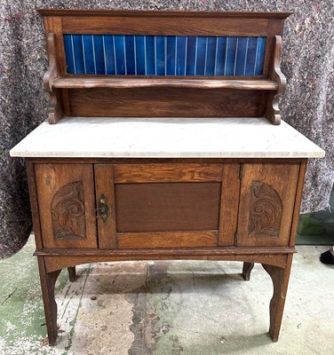Lot 57 - A Victorian wash stand with marble top and...
