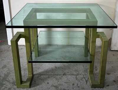 Lot 144 - A side table with two glass shelves on a green...