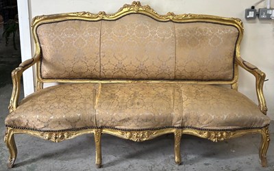 Lot 1 - A French Louis style giltwood salon sofa with...