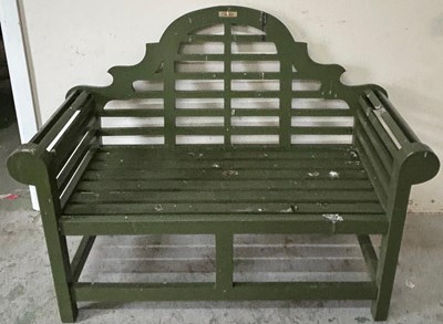 Lot 237 - A two seater green painted garden bench with...