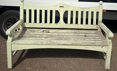 Lot 241 - A garden bench features a notably weathered...