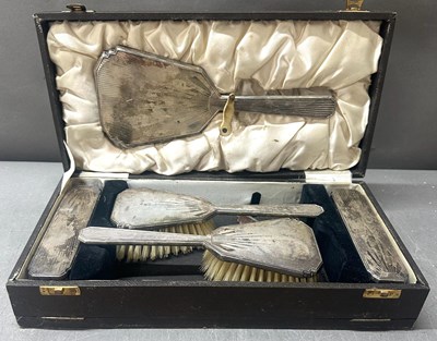 Lot 599 - A five-piece Art Deco vanity set, cased with...