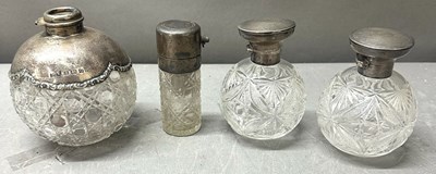 Lot 462 - Four antique cut glass perfume bottles with...