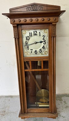 Lot 600 - Arts and crafts style twin weight wall clock,...