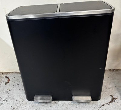 Lot 772 - A dual-pedestal waste bin in black with a...