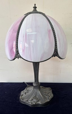 Lot 261 - An Art Nouveau style lamp with a pink shade...
