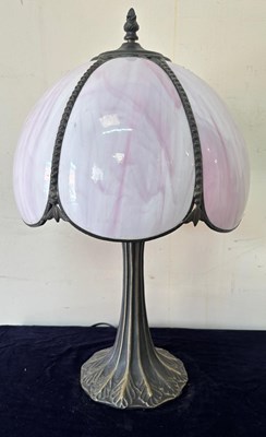Lot 262 - A pink and white slag glass lamp in a Tiffany...