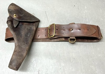 Lot 436C - A brown leather pistol holster and belt with...