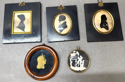 Lot 775 - A trio of portrait silhouettes with brass...