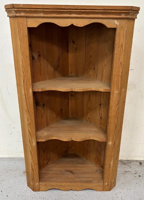 Lot 25 - A pine hanging corner unit with two shelfs