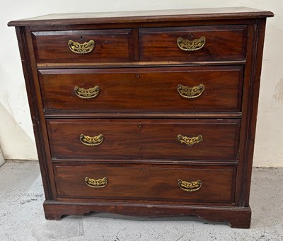 Lot 143 - A mahogany chest of drawers features two short...