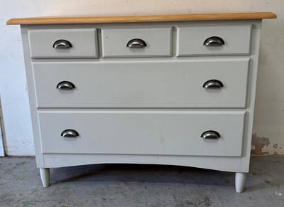 Lot 134 - A modern chest of drawers featuring three...