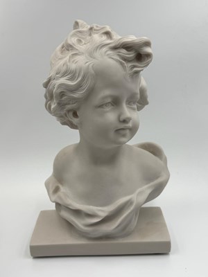 Lot 796 - A Resin bust depicting a child with curly hair...