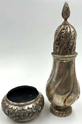 Lot 443 - A sterling silver sugar caster and lid...