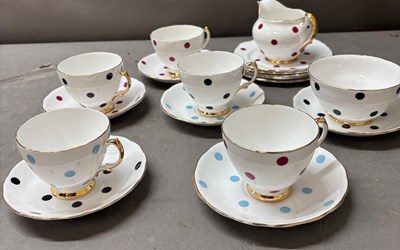Lot 801 - A part tea service in polka dot pattern in...
