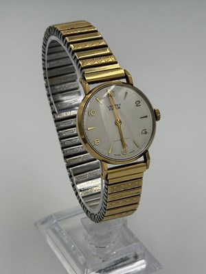 Lot 565 - A 9ct gold, engraved, Vertex Revue gold watch,...