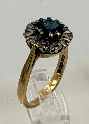 Lot 558 - A 9ct gold sapphire and diamond style daisy...