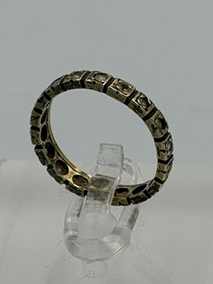Lot 554 - A 9ct gold eternity style ring, approximate...