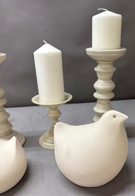 Lot 836 - Three candlestick holders in a distressed...