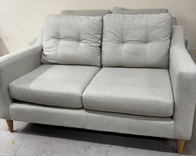 Lot 855 - A modern three and two-seater sofa in a light...