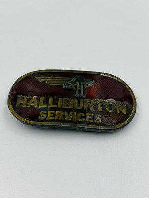 Lot 418 - A Haliburton Services 1977 enamel belt buckle.