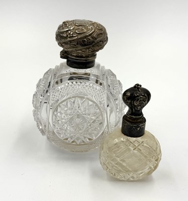 Lot 482 - Two hallmarked silver topped scent bottles.