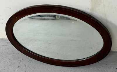 Lot 249 - A mahogany oval mirror 72cm
