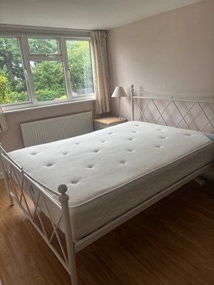 Lot 148 - A metal double bed 4ft 6 with a sleepworks...