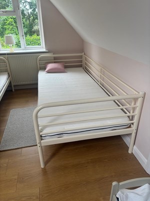 Lot 89 - A single metal Ikea bed with a mattress