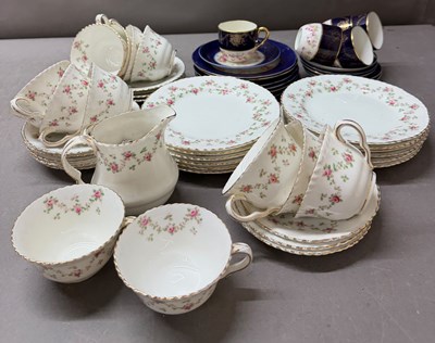 Lot 829 - Crown bone china tea cups and side s along...