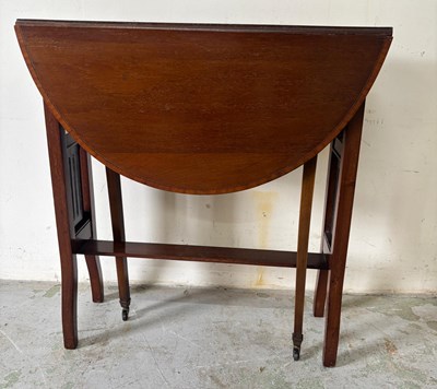 Lot 138 - Edwardian mahogany Sutherland table with cross-...