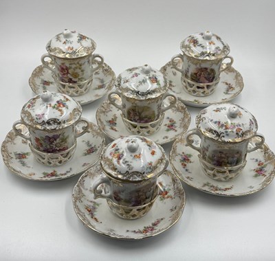 Lot 348 - A set of demitasse cups with lids and pierced...