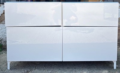Lot 103 - A white sideboard with two drawers on top and...