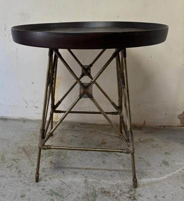 Lot 104 - Round accent table features a dark brown tray...