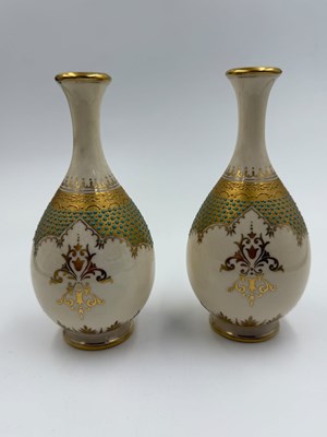 Lot 387 - A pair of Coalport vases painted with...